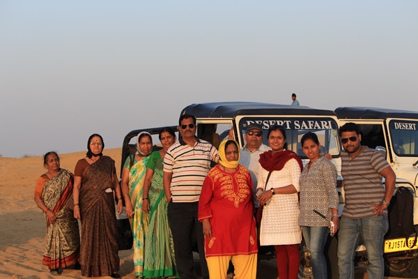 A group of travelers enjoying a camel safari in Jaisalmer