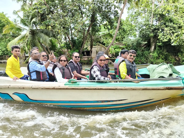 Group of people near a waterfall in Sri Lanka
