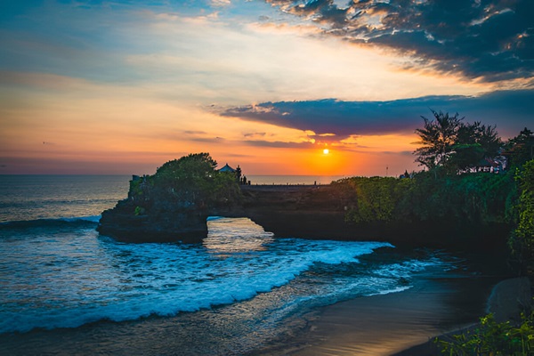 A picturesque view of Tanah Lot Temple at sunset